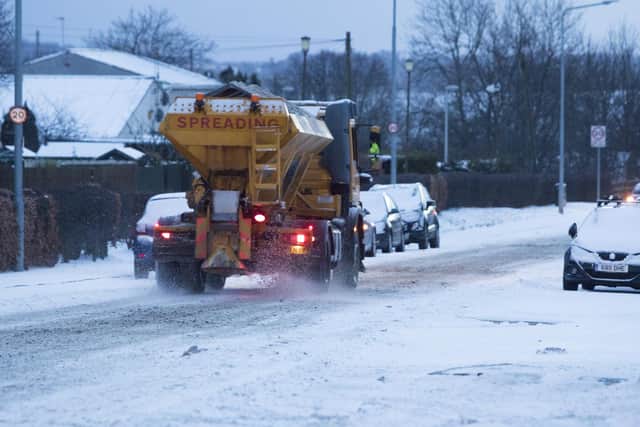 Gritters try to keep road clear from heavy snow in Kirkliston West Lothian.