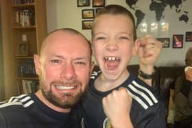 iain Meiklejohn and his son Aleks after the full-time whistle when Scotland beat Serbia on penalties to qualify for Euro 2020