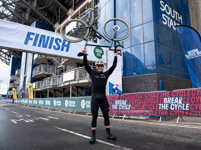 Sir Chris Hoy crosses the finish line in Edinburgh
