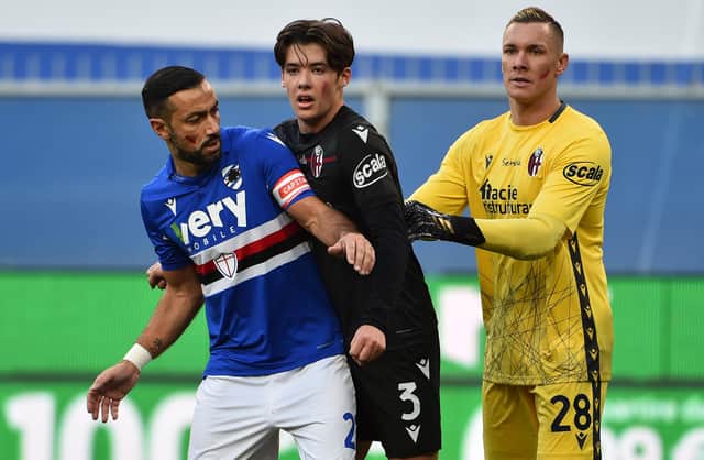 Fabio Quagliarella of UC Sampdoria with Aaron Hickey and Lukasz Skorupski of Bologna FC during the Serie A match between UC Sampdoria and Bologna FC at Stadio Luigi Ferraris on November 22, 2020 in Genoa, Italy. (Photo by Paolo Rattini/Getty Images)