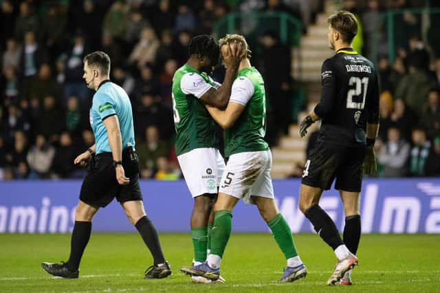Rocky Bushiri (left) with Ryan Porteous at full-time after Hibs drew with rivals Hearts. Picture: SNS