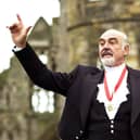Actor Sir Sean Connery, with wife Micheline, in full Highland dress and wearing his medal after he was formally knighted by the Queen in 2000 during a investiture ceremony, at the Palace of Holyroodhouse in Edinburgh. PA