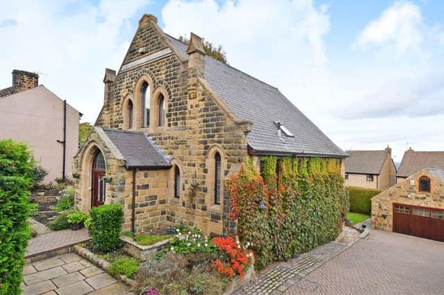 The Old Chapel is set within manicured, private gardens with a gated driveway and a double garage.