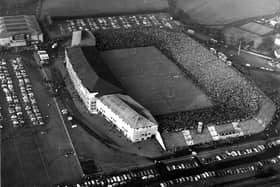 An aerial view of crowds at the largely uncovered Murrayfield Stadium during Scotland v France Rugby International in 1962.