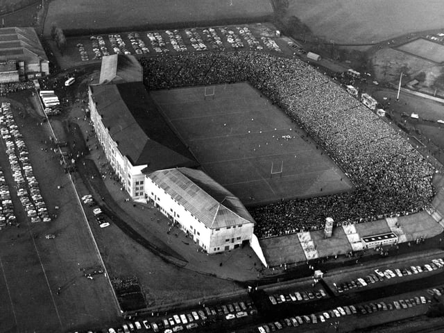 An aerial view of crowds at the largely uncovered Murrayfield Stadium during Scotland v France Rugby International in 1962.