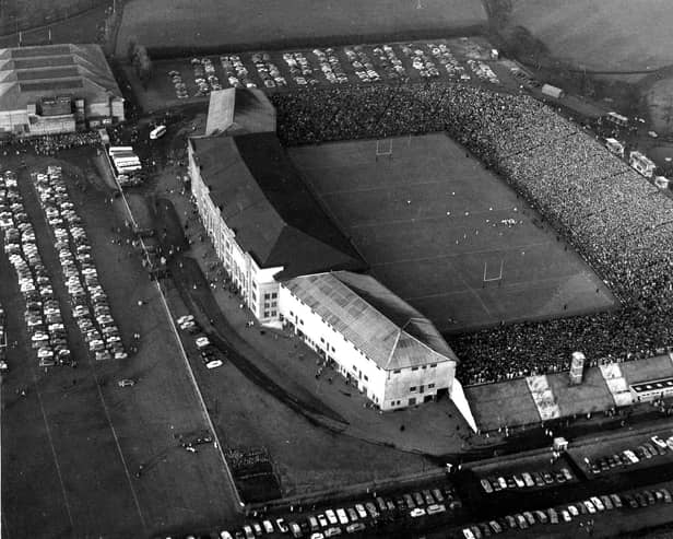 An aerial view of crowds at the largely uncovered Murrayfield Stadium during Scotland v France Rugby International in 1962.