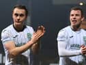 Elias Melkersen, left, and Runar Hauge applaud the Hibs fans after the draw with Dundee