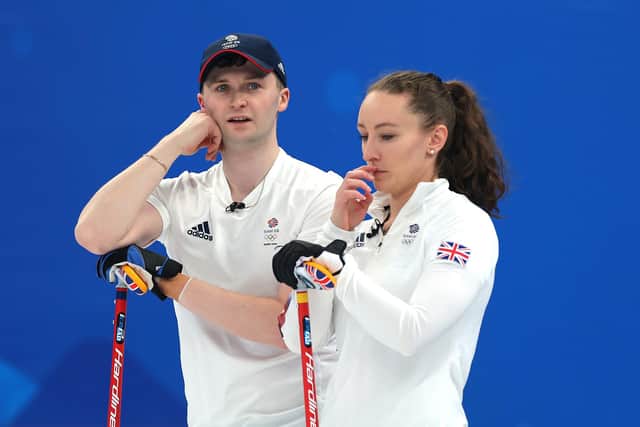 Bruce Mouat and Jenn Dodds of Team GB react following their loss to Sweden during the curling mixed doubles bronze medal game in Beijing