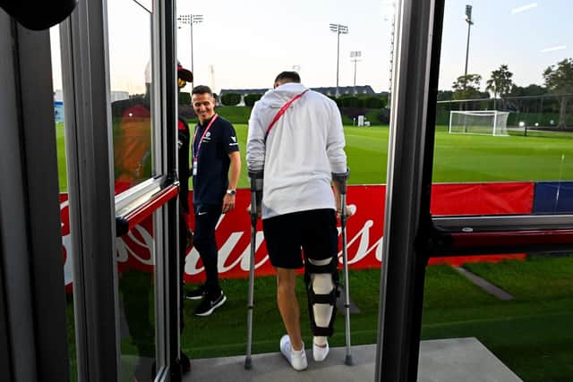 Martin Boyle, pictured leaving the press conference at the Aspire Academy in Doha, has been left on crutches after having surgery to repair his knee. Picture: CHANDAN KHANNA / AFP