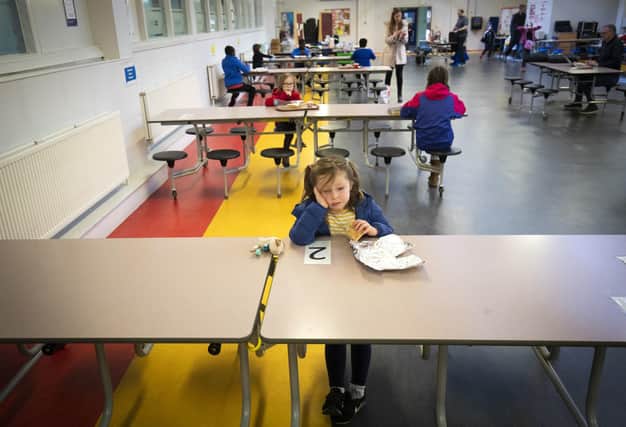 Children of key-workers comply with social distancing rules while attending a hub school at Drummond Community High School (Picture: Jane Barlow/PA Wire)