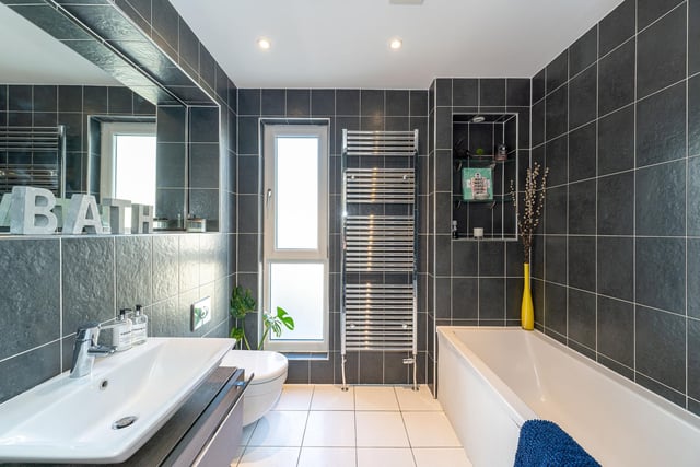 The main family bathroom which has a modern finish with three-piece suite.