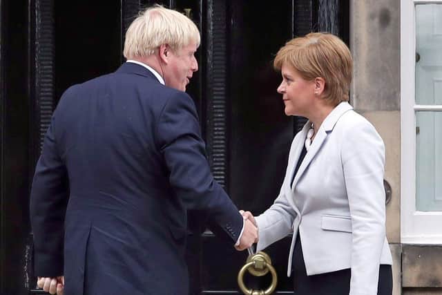 Nicola Sturgeon and Boris Johnson outside Bute House in July 2019   Photo: Jane Barlow/PA Wire