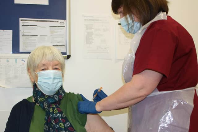 Pauline McHoul, a patient at Riverside Medical Practice, receiving the Covid vaccine from Lead Nurse Diane Fyffe