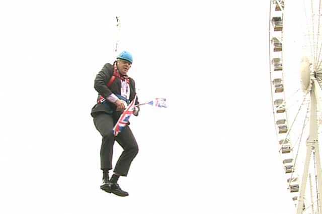 Boris Johnson is left hanging in mid-air after he got stuck on a zipwire in 2012 (Picture: Ben Kendall/PA)