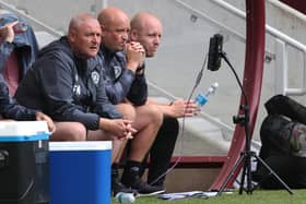Hearts coaches Frankie McAvoy, Gordon Forrest and Steven Naismith in the Tynecastle dugout. Pic: SNS