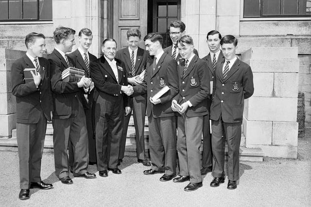 Winning pupils with janitor Mr Vernon after the George Watson's School prize giving in Freemason's Hall in July 1959.