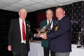 Ronnie Gilbert, right, receiving the Brown Bowl from International Fly Fishing Association (IFFA) president, Paul Sharman, left, and IFFA secretary Michael Callaghan