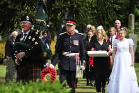 Bo'ness Fair Queen Ellie Van Der Hoek and the Lord Lieutenant Alan Simpson in the procession to the grave of Private Michael Muldoon