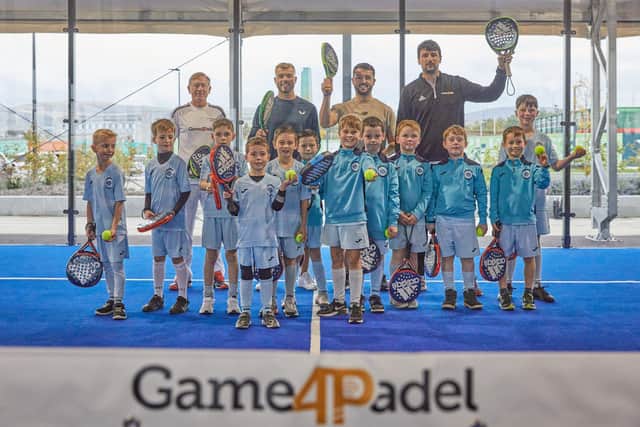 Ryan Porteous, centre left, and Hearts defender Craig Halkett are in attendance at the new Game4Padel courts at Edinburgh Park on Monday afternoon. Picture: Andy Mather