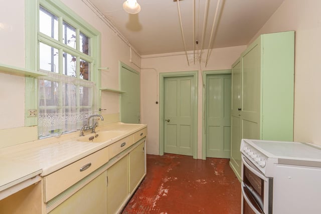 The kitchen is fitted with a sink unit with window and door to rear, larder cupboard with window and a cloakroom with WC.