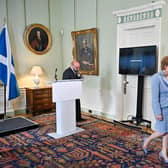 Patrick Harvie and Nicola Sturgeon at Bute House on Friday, cheering the finalisation of a power-sharing agreement. Picture: Jeff J Mitchell/PA Wire.