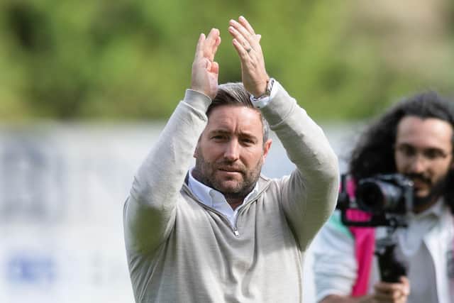 Lee Johnson applauds the travelling Hibs fans at McDiarmid Park