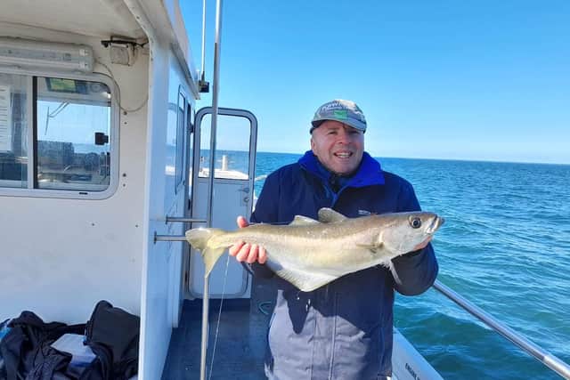 Ronnie Marshall with a fine 6lb pollock landed on an Aquamarine charter as offshore sea fishing re-starts after lockdown. Picture: Derek Anderson/Aquamarine Charters