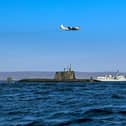 From the Joint Warrior biannual NATO exercise. An Astute class nuclear submarine in company with the Type 23 frigate HMS Kent being over flown by a German Navy P3 maritime patrol aircraft. Pic: Jim Gibson/ Royal Navy