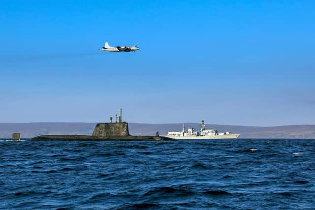 From the Joint Warrior biannual NATO exercise. An Astute class nuclear submarine in company with the Type 23 frigate HMS Kent being over flown by a German Navy P3 maritime patrol aircraft. Pic: Jim Gibson/ Royal Navy