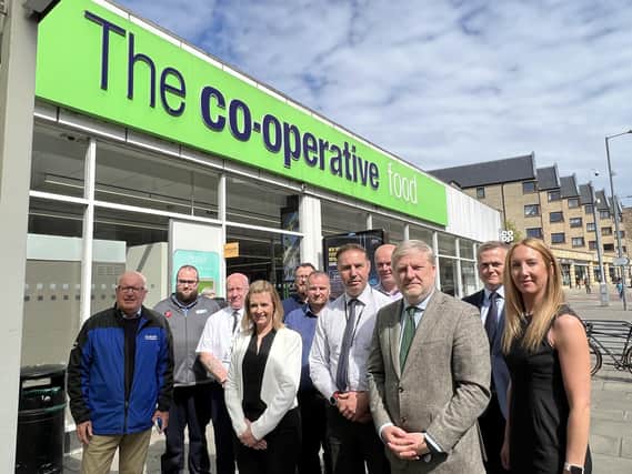 Angus Robertson meets staff and police at a Co-op in Dalry