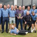 Duddingston's players and team officials celebrate a successful title defence and tenth triumph in the Edinburgh Summer League.