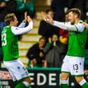 Hibs' Marc McNulty is congratulated by Scott Allan (L) after making it 1-0 during a Ladbrokes Premiership match between Hibernian and Ross County at Easter Road on February 12