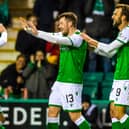 Hibs' Marc McNulty is congratulated by Scott Allan (L) after making it 1-0 during a Ladbrokes Premiership match between Hibernian and Ross County at Easter Road on February 12