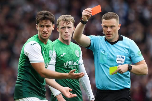Joe Newell protests as he is shown a red card in the semi-final