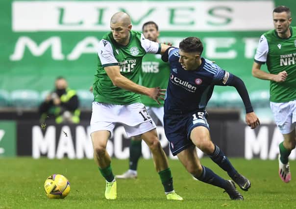 Hibs midfielder Alex Gogic and Andrew Winter of Hamilton battle for the ball during the last meeting betwen the two teams