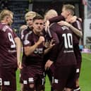 Hearts players celebrate Cammy Devlin's first goal against Rosenborg. Pic: SNS