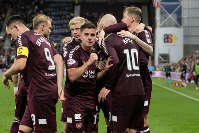 Hearts players celebrate Cammy Devlin's first goal against Rosenborg. Pic: SNS