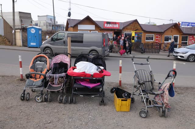 A line of prams at the Medyka border crossing between Poland and Ukraine. These may have been abandoned by families fleeing the fighting (Picture: Sean Gallup/Getty Images)