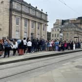 Long queues wait at St Andrew Square tram stop to travel to Murrayfield for the Beyonce concert.