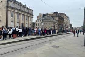 Long queues wait at St Andrew Square tram stop to travel to Murrayfield for the Beyonce concert.