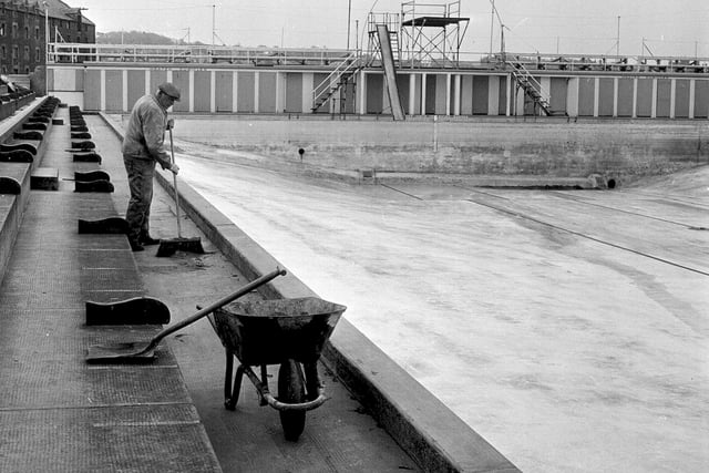 The North Berwick Open Air Pool being cleaned in preparation for the start of the swimming season in 1964.