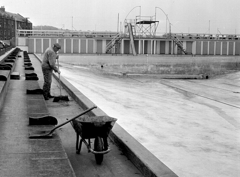 The North Berwick Open Air Pool being cleaned in preparation for the start of the swimming season in 1964.