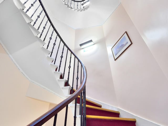 Each floor in the townhouses is connected by a centrally located curved staircase, with a cupola above allowing plenty of daylight. Photo: Ryden