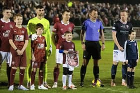 LINLITHGOW, SCOTAND - JANUARY 24: Linlithgow's Greg Skinner, Cammy Binnie and Gary Thom line up before kick off alongside the referee and Raith's Scott Brown during a Scottish Cup fourth round match between Linlithgow Rose and Raith Rovers at Prestonfield, on January 24, 2023, in Linlithgow, Scotland. (Photo by Mark Scates / SNS Group)
