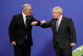 Boris Johnson greets Australian Prime Minister Scott Morrison upon his arrival at the COP26 summit