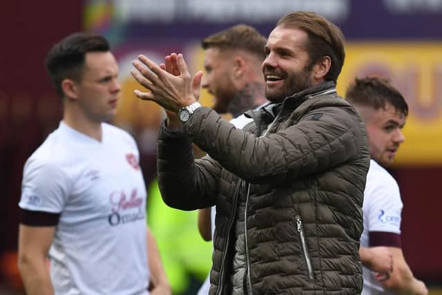 Hearts boss Robbie Neilson applauds the fans at full time after Sunday's 3-0 win away to Motherwell. Ross MacDonald / SNS