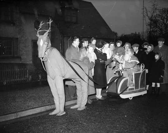 Santa and his reindeer delivering toys on Pennywell Road in Muirhouse.
