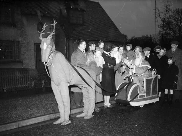 Santa and his reindeer delivering toys on Pennywell Road in Muirhouse.