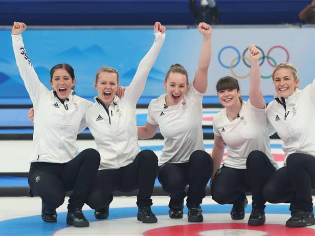 Eve Muirhead, Vicky Wright, Jennifer Dodds, Hailey Duff and reserve Mili Smith of Team Great Britain celebrate after defeating Japan in the women's gold medal match