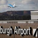 Travellers at Edinburgh Airport faced long queues last night as a result of a 'nationwide issue' which took E-gates out of action